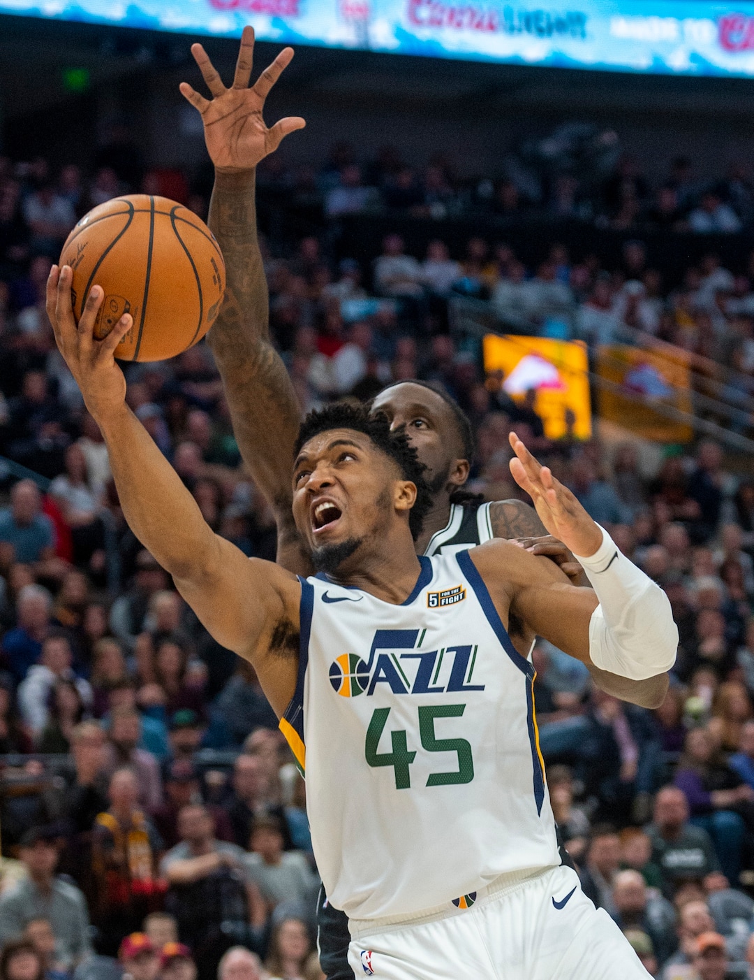 (Rick Egan  |  The Salt Lake Tribune)        Utah Jazz guard Donovan Mitchell (45) scores as Brooklyn Nets guard Spencer Dinwiddie (8) defends, in NBA basketball action between the Utah Jazz and the Brooklyn Nets in Salt Lake City, Tuesday, Nov 12, 2019.