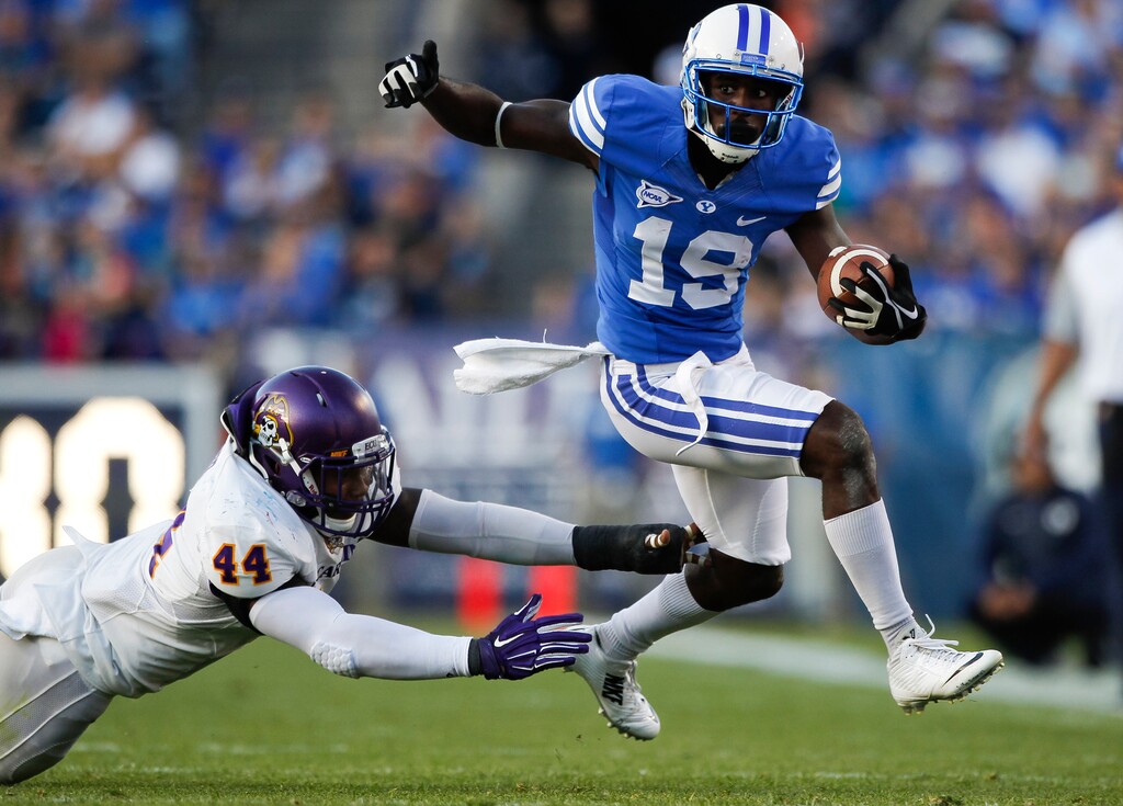 BYU wide receiver Devon Blackmon (19) stays just ahead of East Carolina linebacker Zeek Bigger (44) during the first half in an NCAA college football game, Saturday, Oct. 10, 2015 in Provo, Utah. (Spenser Heaps/The Daily Herald via AP) MANDATORY CREDIT