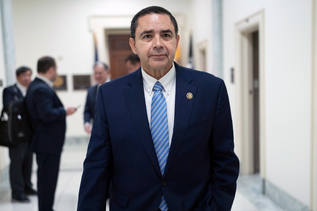 Rep. Henry Cuellar, D-Texas, walks from his office to the House chamber to vote on Capitol Hill, Wednesday, May 15, 2024, in Washington. Federal authorities have charged Cuellar, 68, and his wife Imelda Cuellar, 67, of accepting money from 2014 to 2021 in exchange for the congressman advancing the interests of the former Soviet republic and the Mexican bank in the U.S. He says they are innocent. (AP Photo/Jose Luis Magana)