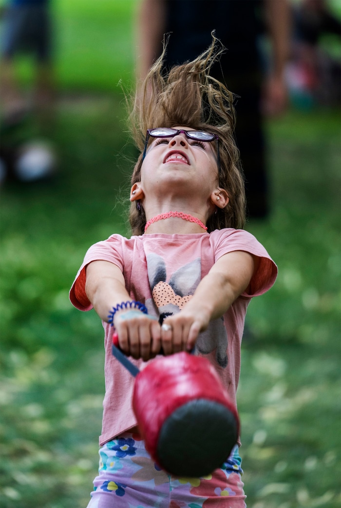 (Rick Egan | The Salt Lake Tribune) Pixie Strong, 7, from Spanish Fork, competes in the featherweight Toss, at the Payson Scottish Festival, on Saturday, July 9, 2022.
