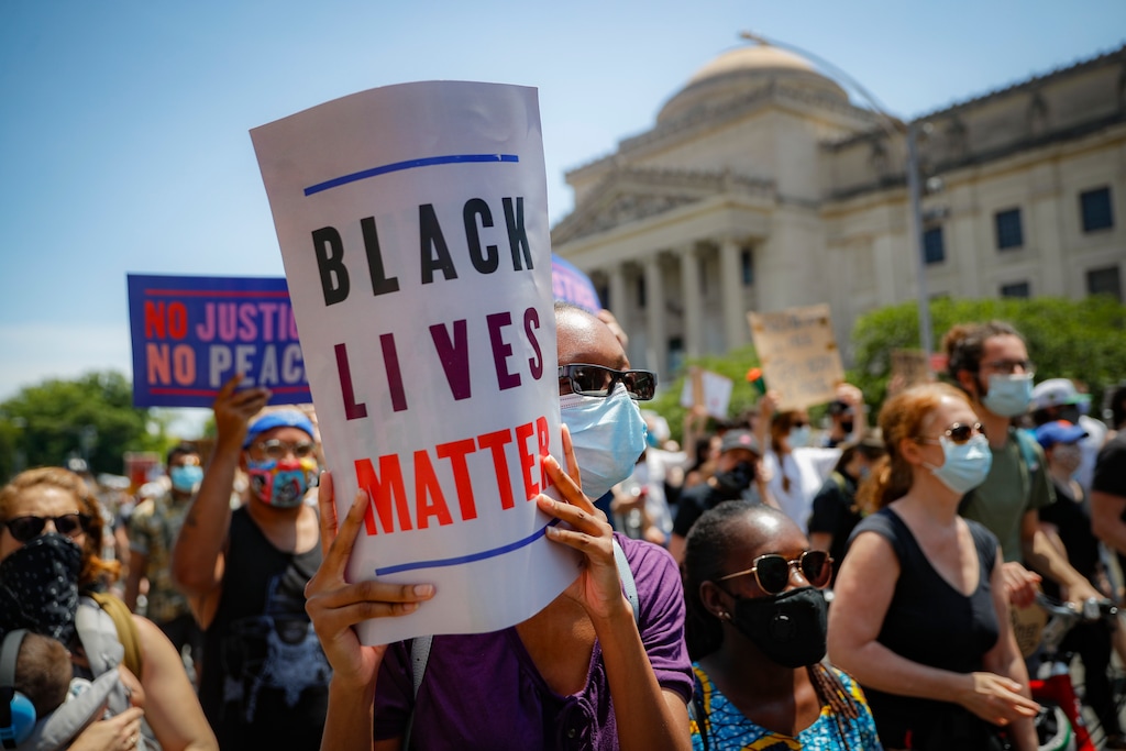 (John Minchillo | AP file photo) Protesters wear protective masks June 19 as they march after a Juneteenth rally outside the Brooklyn Museum, in the Brooklyn borough of New York. A loose network of Facebook groups that took root across the country in April to organize protests over coronavirus stay-at-home orders has become a hub of misinformation and conspiracies theories that have pivoted to a variety of new targets. Their latest: Black Lives Matter and the nationwide protests against racial injustice.