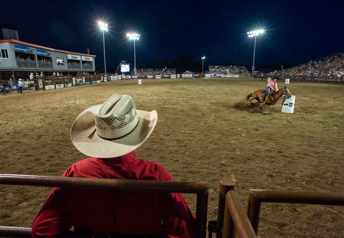 (Rick Egan  |  The Salt Lake Tribune)     A barrel racer competes, at the West Jordan Western Stampede Rodeo, Saturday, July 6, 2019.