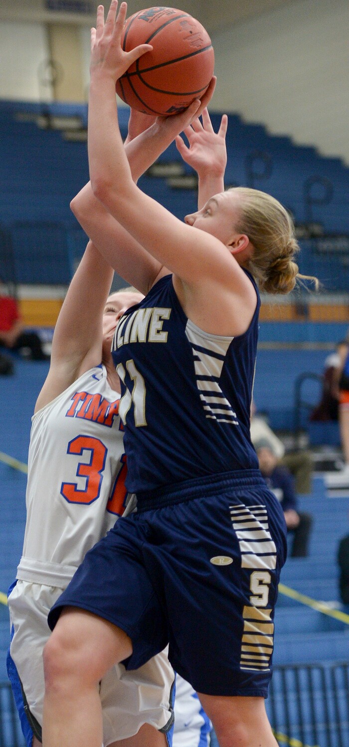 (Leah Hogsten  |  The Salt Lake Tribune) Timpview's Taylor Ross (31) fouls Skyline's Barrett Jessop (11) on her way to the net.  Timpview faces Skyline in their semifinal game of the 5A High School Girls' Basketball Tournament at SLCC in Taylorsville, Friday, Feb. 23, 2018. 
