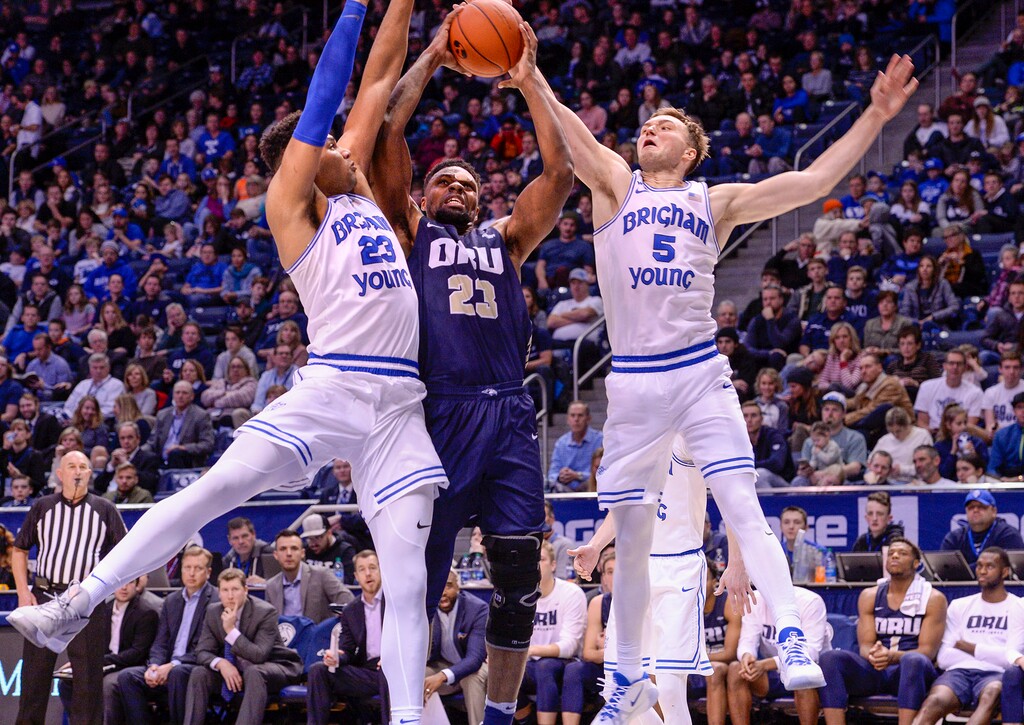 (Leah Hogsten | The Salt Lake Tribune) Brigham Young Cougars forward Yoeli Childs (23) and Brigham Young Cougars guard Jake Toolson (5) pressure Oral Roberts Golden Eagles forward Emmanuel Nzekwesi (23). Brigham Young University defeated Oral Roberts, 79-73, Dec. 28, 2019 at the Marriott Center in Provo.