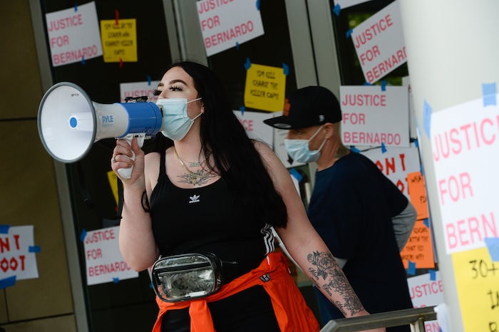 (Francisco Kjolseth  |  The Salt Lake Tribune) Sofia Alcala leads the crowd as they chant during a Rally for Bernardo Palacios, in front of the Salt Lake County District Attorney's office on Thursday, June 18, 2020.