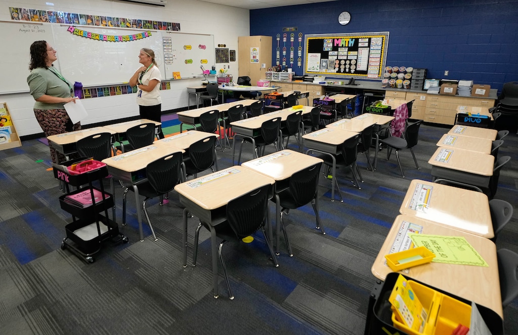 (Francisco Kjolseth | The Salt Lake Tribune) Second grade teachers Cami Beacham, left, and Amy Bartlett talk during the first week of classes at Desert Sky Elementary, Eagle Mountain’s new elementary school on Monday, Aug. 21, 2023.