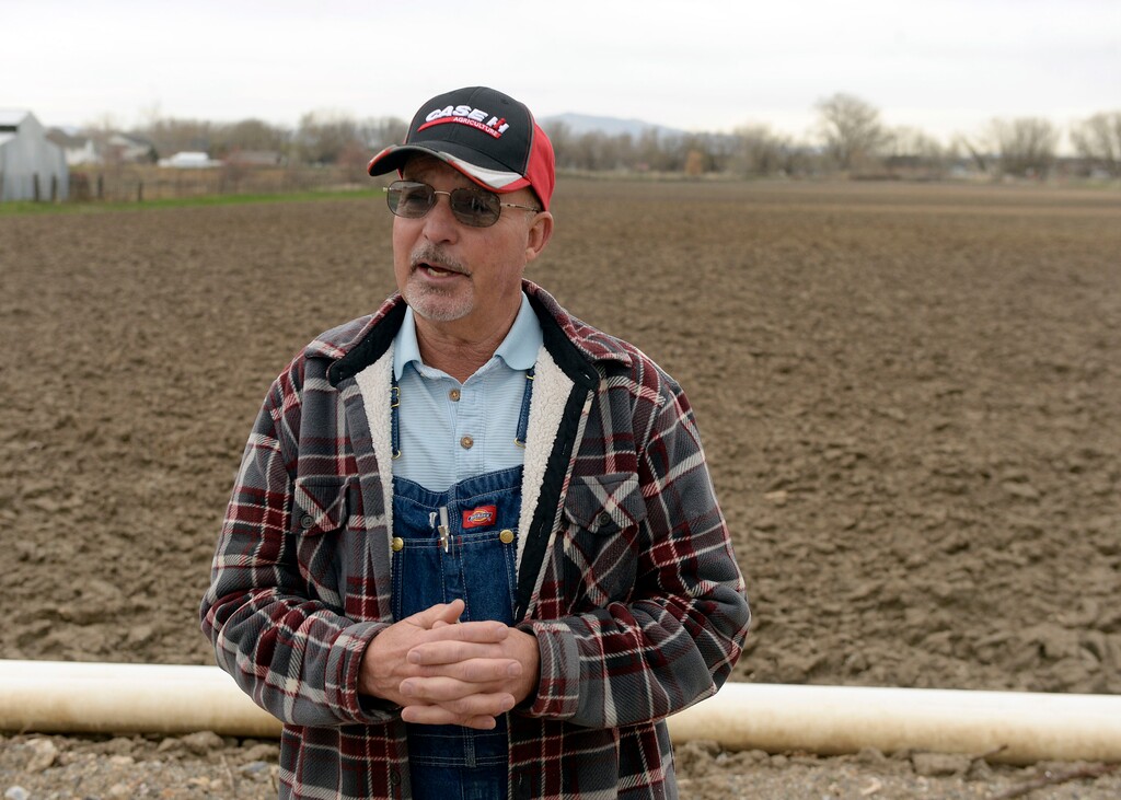(Al Hartmann  |  The Salt Lake Tribune) Longtime Utah farmer Alan Bangerter stands in front of a 23-acre field where he grows vegetables in Farmington.