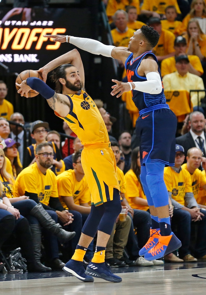 Oklahoma City Thunder guard Russell Westbrook, right, defends against Utah Jazz guard Ricky Rubio during the first half of Game 6 of an NBA basketball first-round playoff series Friday, April 27, 2018, in Salt Lake City. (AP Photo/Rick Bowmer)