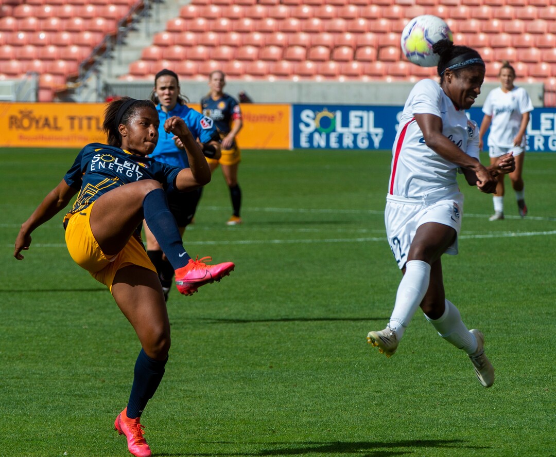 (Rick Egan  |  The Salt Lake Tribune) Utah Royals FC midfielder  Elizabeth Ball (7) kicks the ball as OL Reign FC forward Jasmyne Spencer (22) defends, in soccer action between Utah Royals FC and Ol Reign FC at Rio Tinto Stadium in Sandy, Saturday, Sept. 26, 2020.