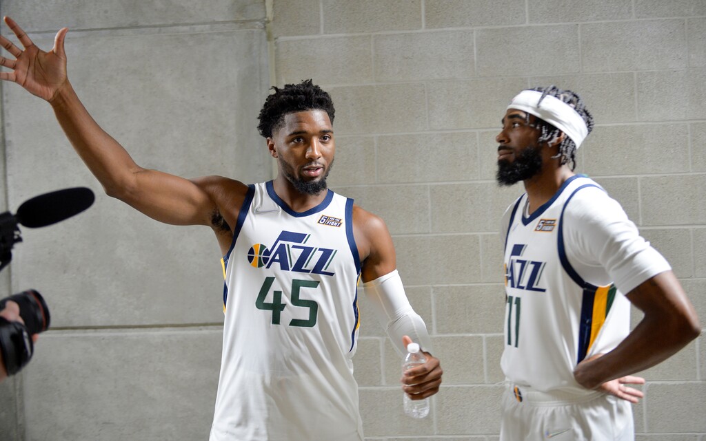 (Chris Samuels | The Salt Lake Tribune) Guards Donovan Mitchell (45) and Mike Conley (11) converse outside the interview room during Utah Jazz media day at Vivint Arena, Monday, Sept. 27, 2021 in Salt Lake City.