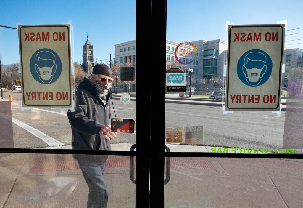 (Francisco Kjolseth  | The Salt Lake Tribune) A customers enters the Green Pig Pub in Salt Lake City on Thursday, Dec. 3, 2020, during the lunch hour. The owners of 25 different Utah bars — including the Green Pig Pub —  have sent a letter to Gov. Gary Herbert protesting the state health order that requires alcohol service to stop at 10 p.m They say the restriction is devastating the bar industry in Utah and has caused hundreds of thousands of dollars in lost  revenue, hurt employees, and could force many to close. 