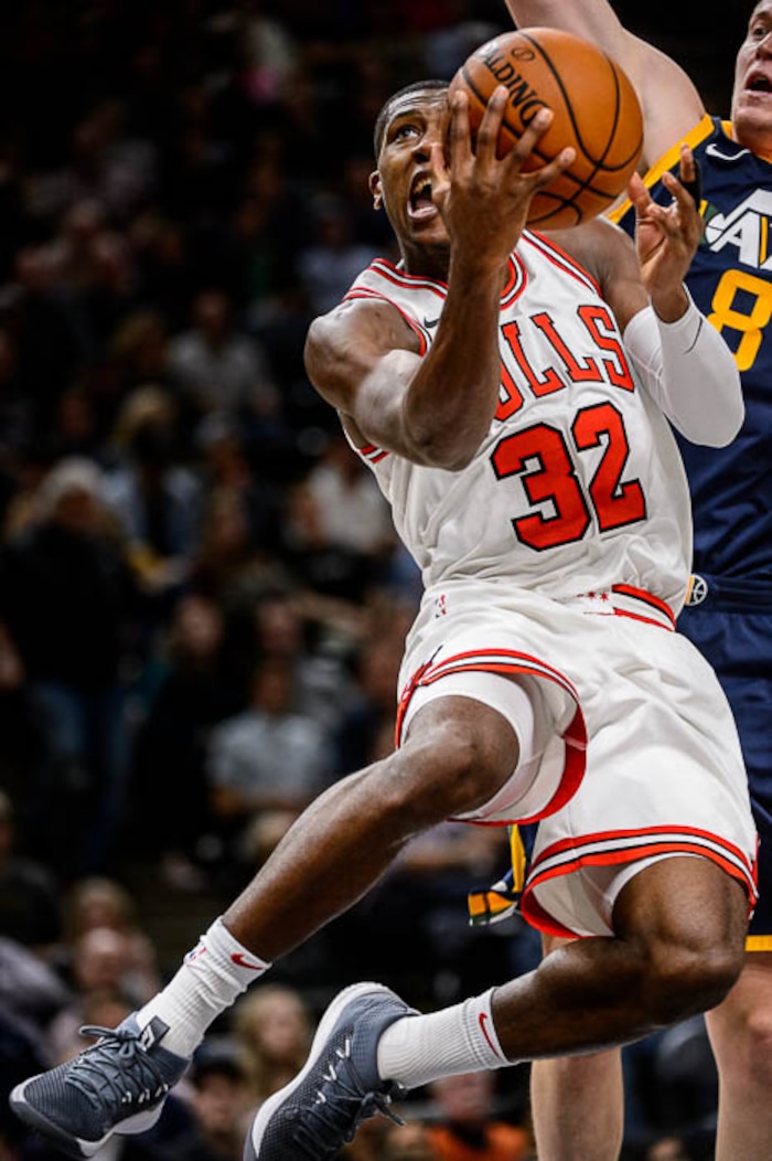 (Trent Nelson | The Salt Lake Tribune)  Chicago Bulls guard Kris Dunn (32) goes up for a shot, with Utah Jazz forward Jonas Jerebko (8) behind, as the Utah Jazz host the Chicago Bulls, NBA basketball in Salt Lake City Wednesday November 22, 2017.