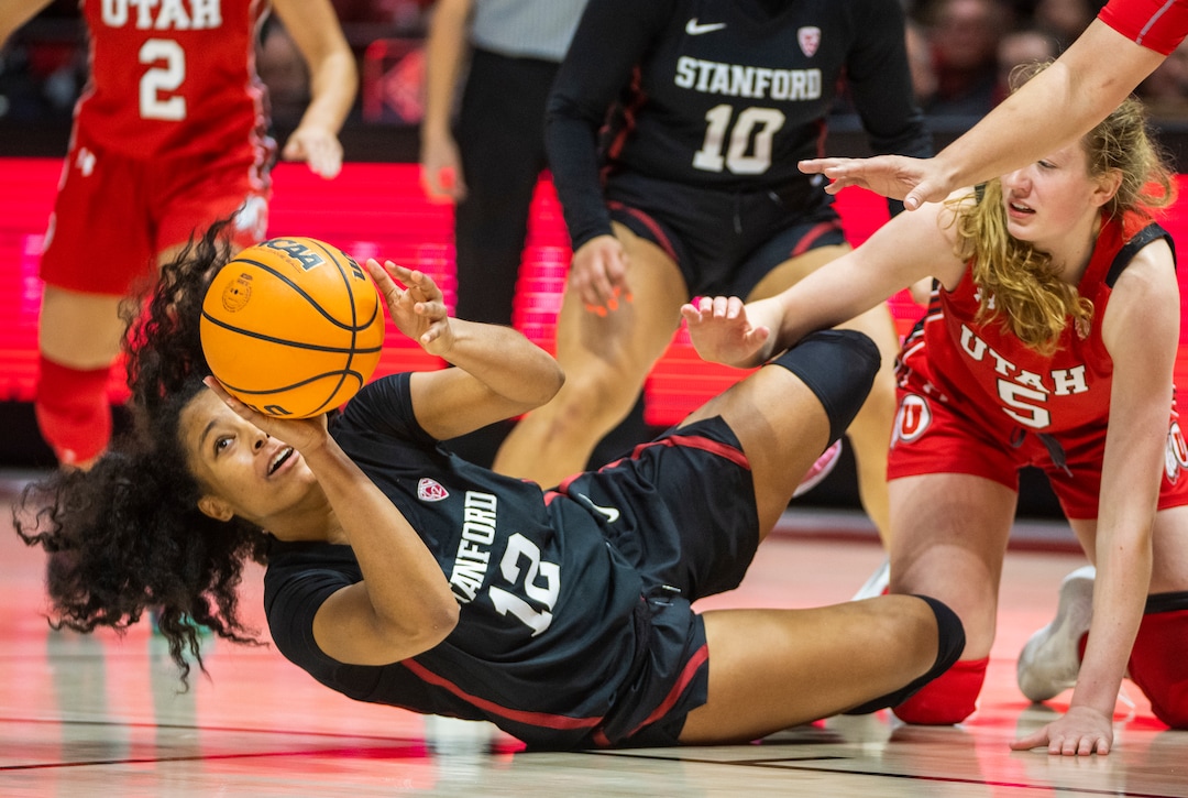 (Rick Egan | The Salt Lake Tribune) Stanford Cardinal guard Indya Nivar (12) and Utah Utes guard Gianna Kneepkens (5) go for a loose ball, in PAC-12 action between the Utah Utesand the Stanford Cardinals, at the Jon M. Huntsman Center, on Saturday, Feb. 25, 2023.