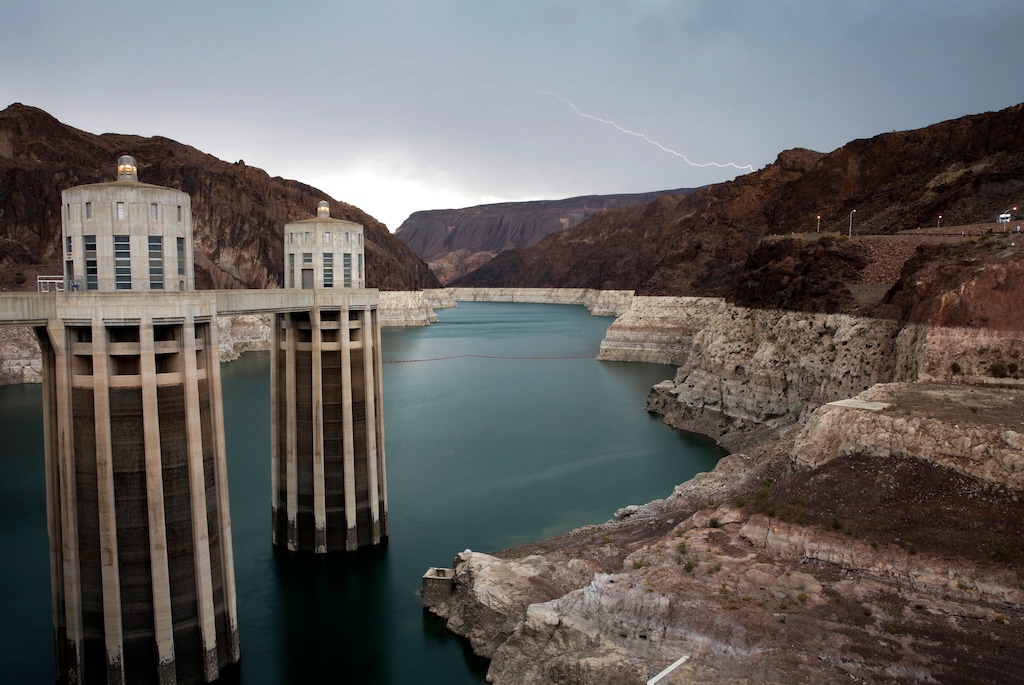 (John Locher  |  AP Photo)   In this July 28, 2014, file photo, lightning strikes over Lake Mead near Hoover Dam that impounds Colorado River water at the Lake Mead National Recreation Area in Arizona.