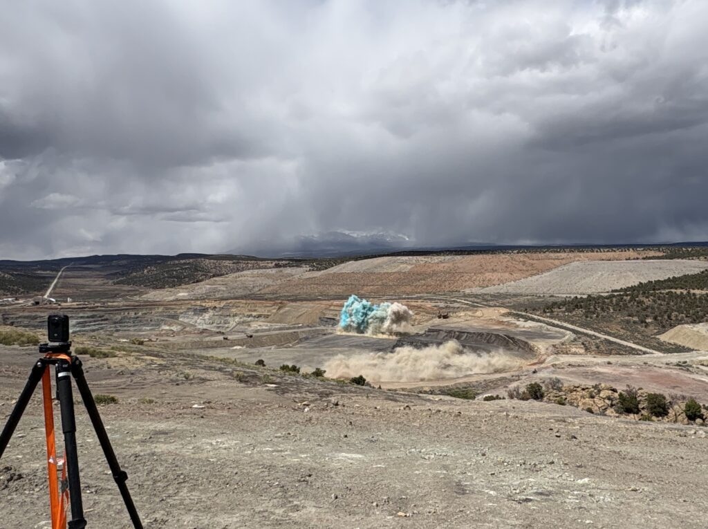 (Andrew Christiansen | The Times-Independent) A controlled blast expands part of the open pit at Mariana Minerals’ Copper One site in Lisbon Valley during a ceremonial event marking the company’s ongoing restart of mining operations.