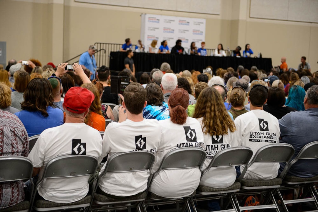 (Trent Nelson | The Salt Lake Tribune)  Utah Gun Exchange t-shirts in the audience at a town hall put on by the March for Our Lives movement at the Mountain America Expo Center in Sandy, Saturday July 14, 2018.