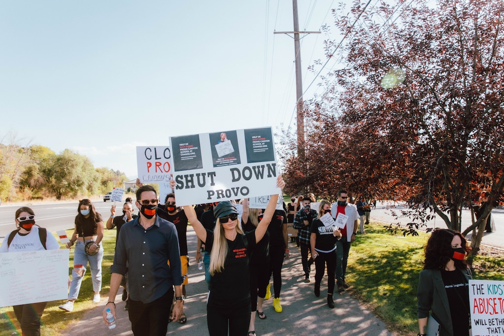 (11:11 Media) Paris Hilton photographed walking in a rally against Provo Canyon School.