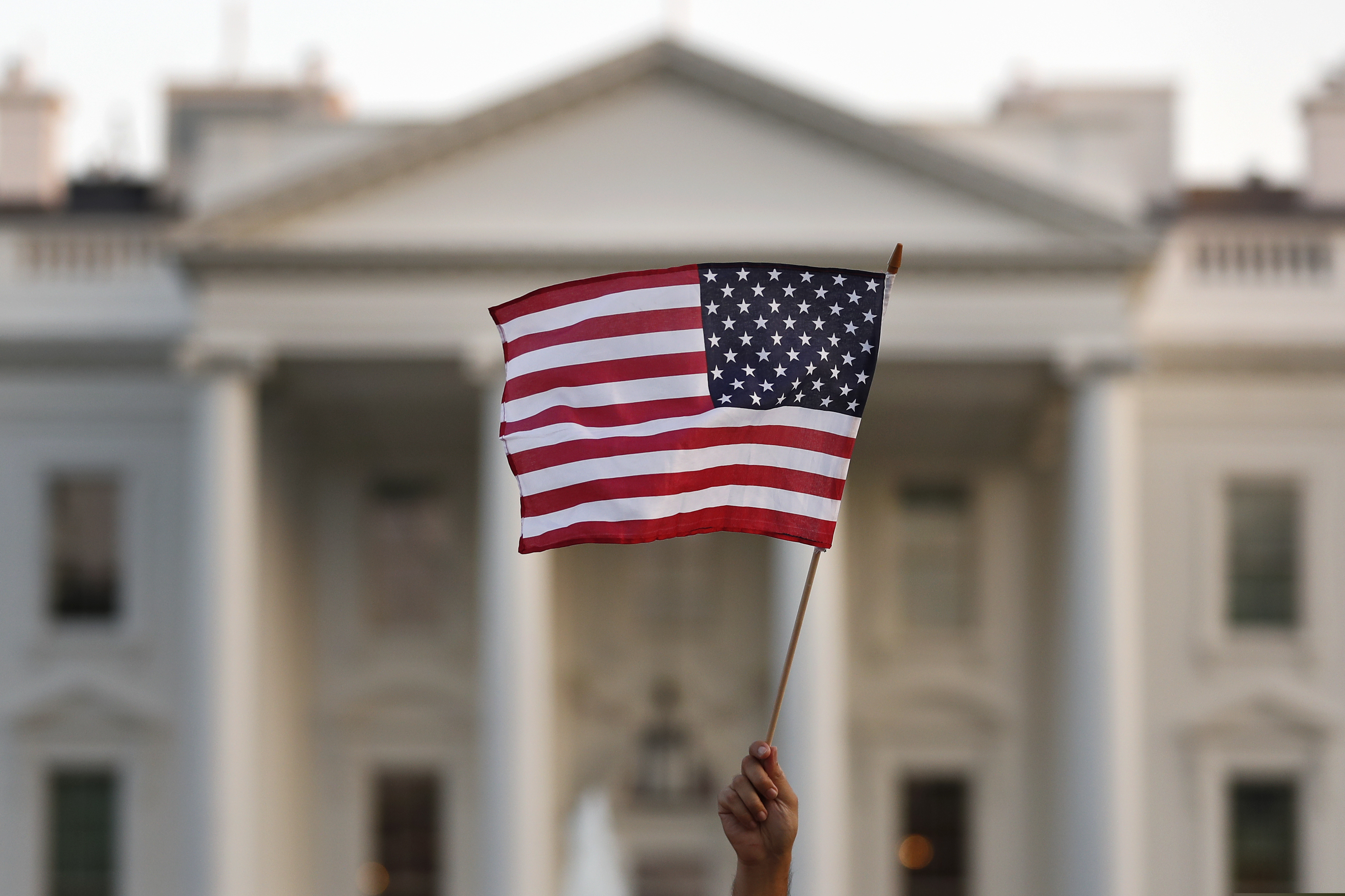 (Carolyn Kaster | AP file photo)  A flag is waved outside the White House in Washington on Sept. 5, 2017.