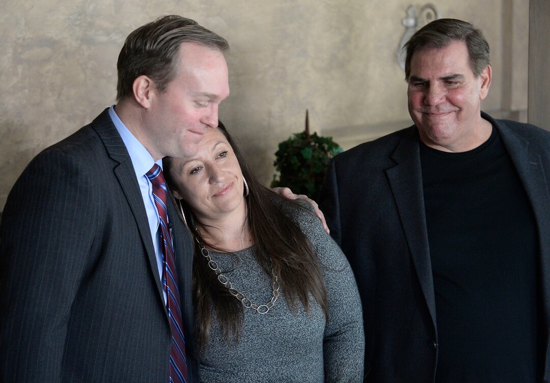 (Al Hartmann  |  The Salt Lake Tribune) 	Salt Lake Couty Mayor Ben McAdams gives a hug of thanks and encouragement to Destiny Garcia, (the first Operation Rio Grand client to move into a sober living home) at the opening  of a new sober living housing program Monday Jan. 29 in Murray. Michael Brown, Executive Director of Next Level Recovery, right. The combined county and state funded program places people in safe, affordable housing while continuing to receive treatment for substance use.  The residential home is now open in Murray providing space for 12 residents