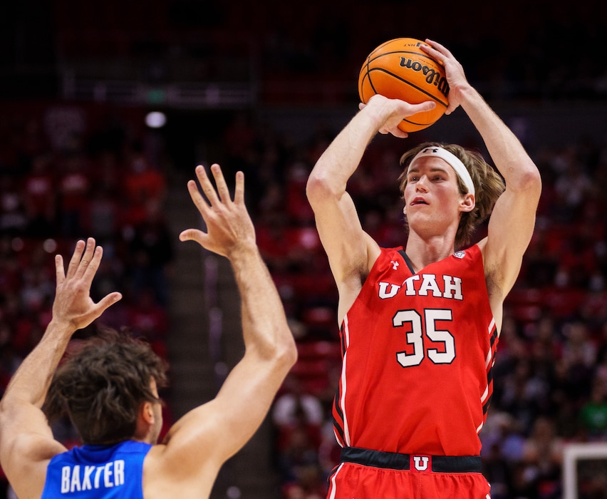 (Trent Nelson  |  The Salt Lake Tribune) Utah Utes center Branden Carlson (35) shoots over Brigham Young Cougars forward Gavin Baxter (51) as the Utah Utes host BYU, NCAA basketball in Salt Lake City on Saturday, Nov. 27, 2021.