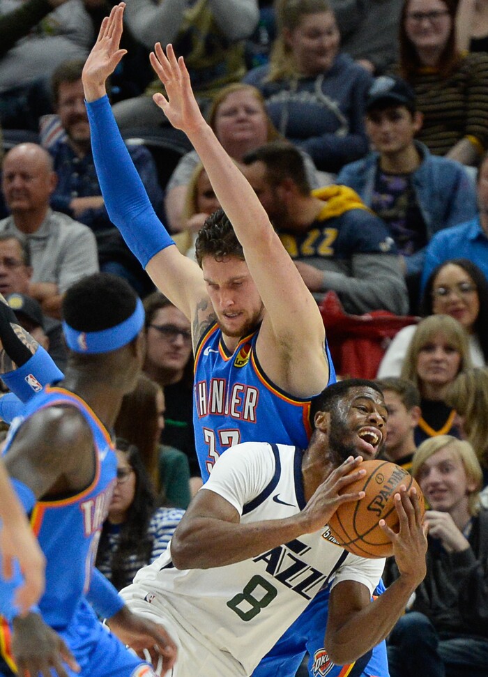 (Francisco Kjolseth  |  The Salt Lake Tribune)  Oklahoma City Thunder forward Mike Muscala (33) blocks Utah Jazz guard Emmanuel Mudiay (8) on his way to the basket as the Utah Jazz host the Oklahoma City Thunder in their NBA basketball game at Vivint Smart Home Arena in Salt Lake City on Mon. Dec. 9, 2019.