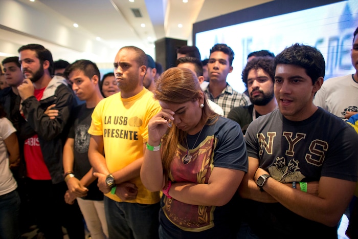 Opposition members react as the President of Venezuelan National Electoral Council Tibisay Lucena announces that the candidates for the ruling socialist party have won a majority of the 23 governors' offices up for grabs in regional elections at opposition headquarters in Caracas, Venezuela Oct 15, 2017. Pro-government electoral council president Tibisay Lucena says opposition candidates won just five of 22 races where the results are considered irreversible. (AP Photo/Ariana Cubillos)