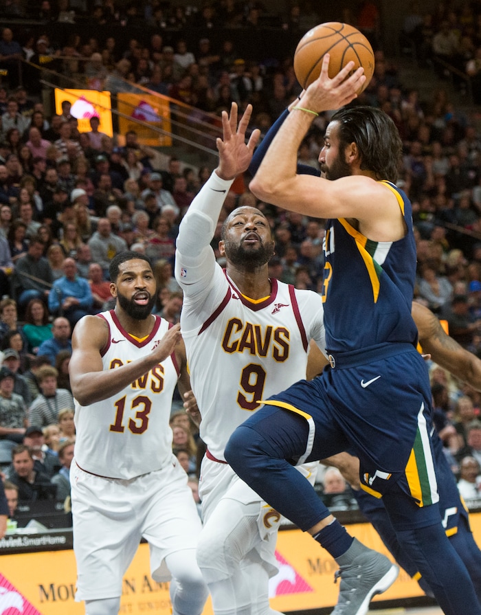 (Rick Egan  |  The Salt Lake Tribune)   Cleveland Cavaliers guard Dwyane Wade (9) defends as Utah Jazz guard Ricky Rubio (3) takes the ball to the hoop, in NBA action Utah Jazz vs Cleveland Cavaliers, in Salt Lake City,  Saturday, December 30, 2017.


