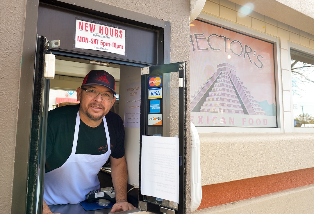 (Chris Samuels | The Salt Lake Tribune) Hector Uribe poses for a photograph outside the drive-through window at Hector’s Mexican Food in Millcreek, Friday, Nov. 4, 2022.