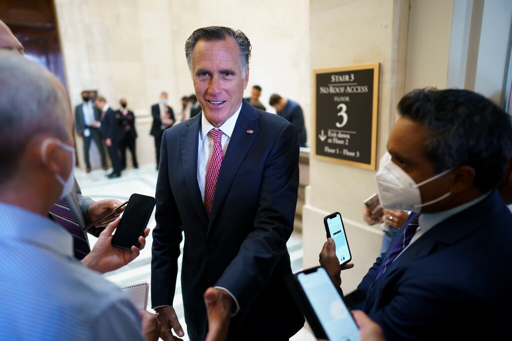 (J. Scott Applewhite | AP) 

Sen. Mitt Romney, R-Utah, talks briefly to reporters after attending a bipartisan barbecue luncheon, at the Capitol in Washington, Thursday, Sept. 23, 2021.