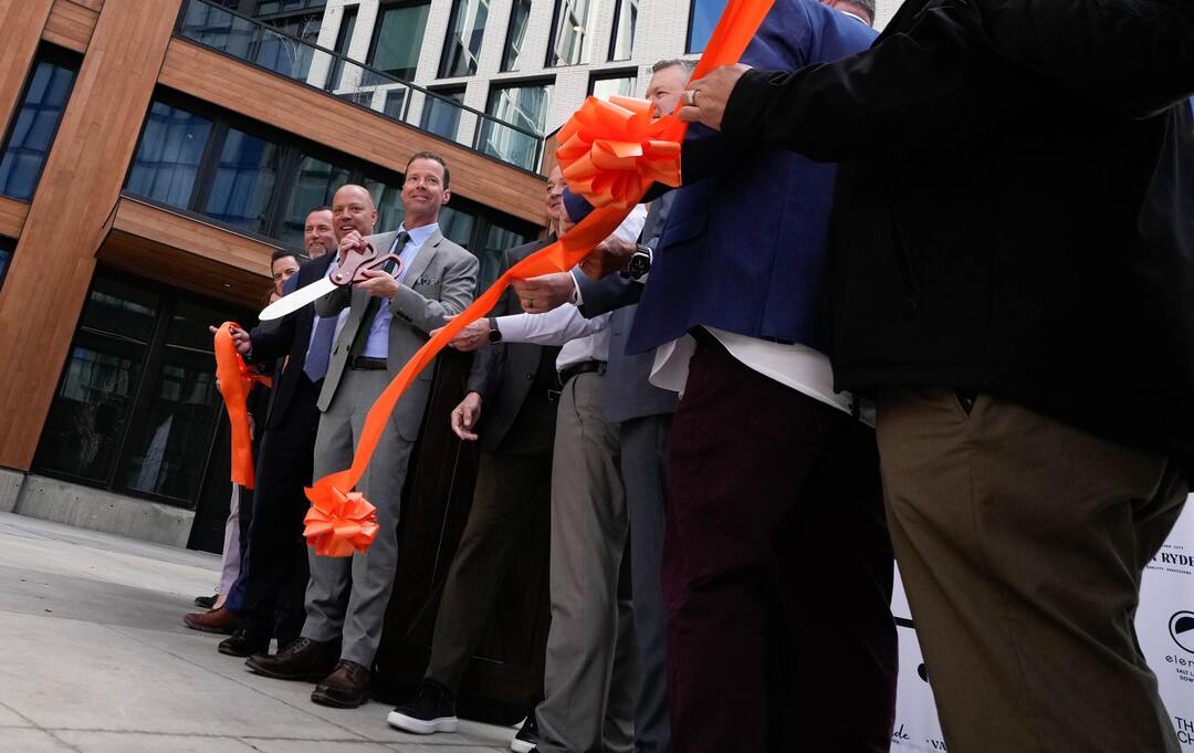 (Francisco Kjolseth | The Salt Lake Tribune) Developer Ryan Ritchie cuts the ribbon as a new residential and hospitality center known West Quarter, located at 100 South and 300 West in Salt Lake City, opened on Wednesday, April 19, 2023. It includes 240 luxury apartments in a tower called The Charles and 272 guest rooms spread over two hotels, Le Meridien and Element, along with several restaurants and soon-to-be opened retail outlets at ground level.