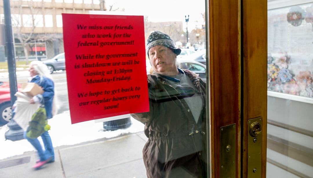 Leah Hogsten  |  The Salt Lake Tribune  Businesses in Ogden are also suffering from the government shutdown. A sign on The Bickering Sisters restaurant across from the  Federal Building in Ogden told customers that the eatery would be scaling back their hours of operation due to the lack of customers, Jan. 10, 2019.