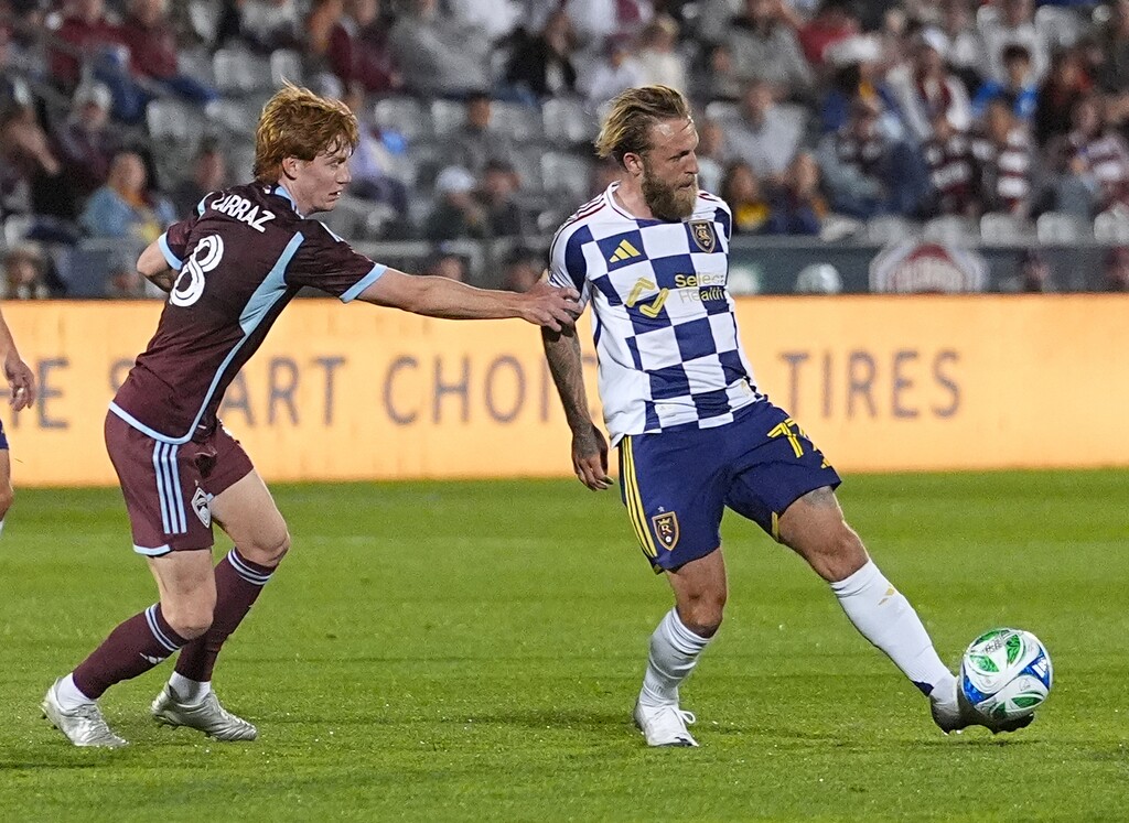 Real Salt Lake striker Johnny Russell, right, shown during a game against the Colorado Rapids on May 17, scored for RSL in a draw with Sporting Kansas City on Saturday. (AP Photo/David Zalubowski)
