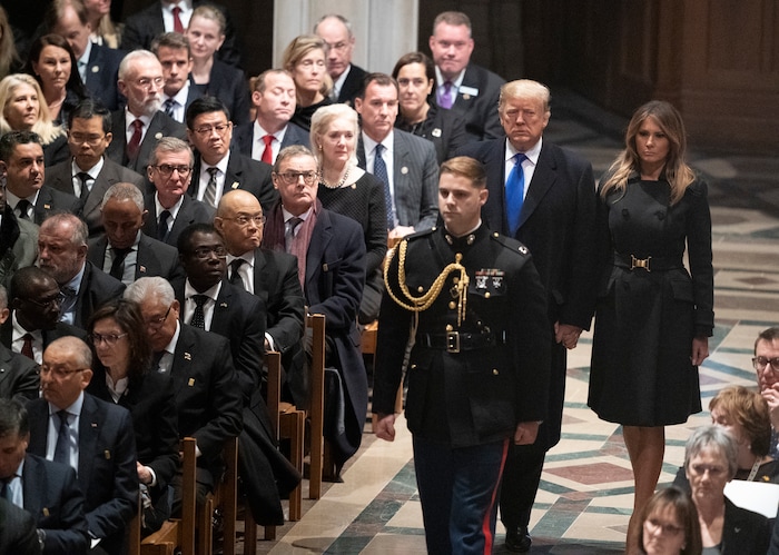 President Donald Trump and first lady Melania Trump arrive for the State Funeral for former President George H.W. Bush at the Washington National Cathedral in Washington, Wednesday, Dec. 5, 2018. (AP Photo/Carolyn Kaster)