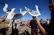 (Francisco Kjolseth | The Salt Lake Tribune) Wilson’s phalarope bird costumes are distributed to 6th graders from Emerson Elementary as they participate in a call to action to save the bird during a rally at the Great Salt Lake on Wednesday, Oct. 1, 2025. 