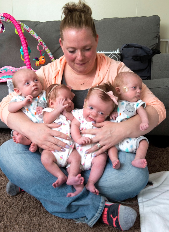 (Rick Egan  |  The Salt Lake Tribune)       Kayla Glines holds quadruplets, Reese, Lincoln, Oaklee and Jamesen at her home in Ogden, Saturday, June 15, 2019.