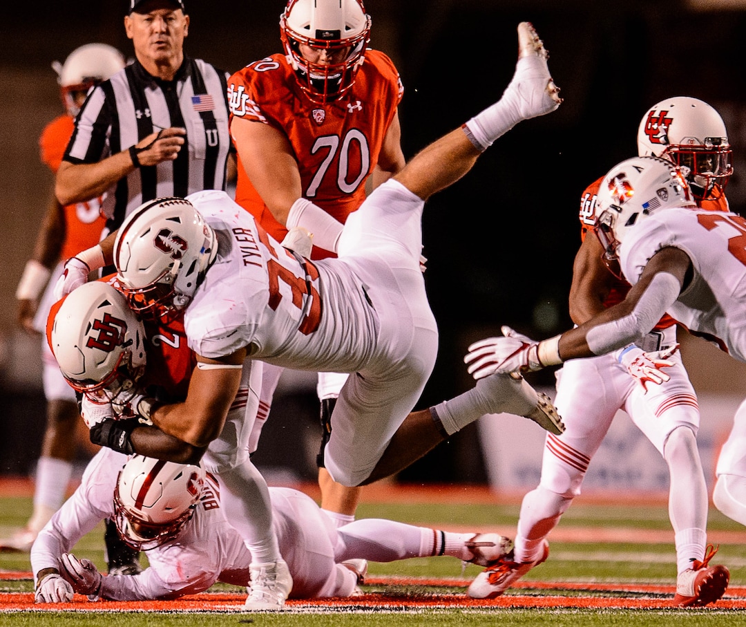 (Trent Nelson | The Salt Lake Tribune)  Stanford Cardinal linebacker Mike Tyler (33) tackles Utah Utes running back Zack Moss (2) as the University of Utah hosts Stanford, NCAA football at Rice-Eccles Stadium in Salt Lake City Saturday October 7, 2017.