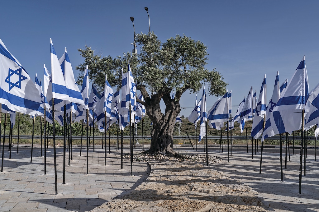 Israeli flags are seen on a Palestinian road leading to Rawabi, in the West Bank, on May 19, 2026. (Samar Hazboun/The New York Times)