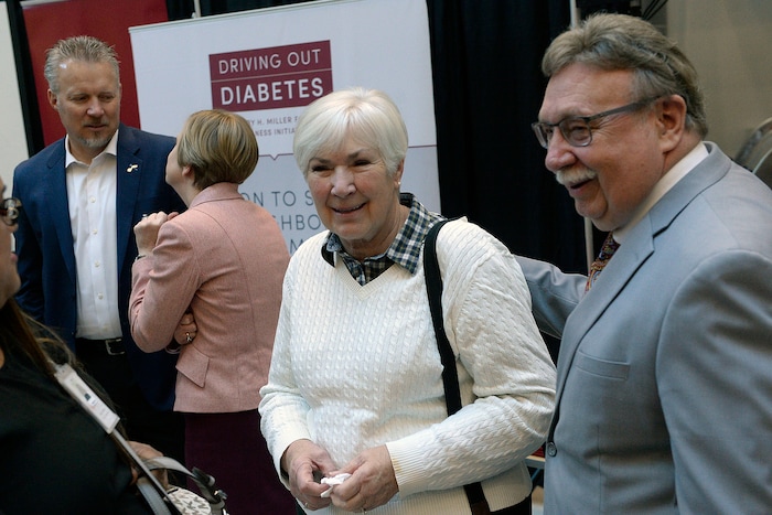 (Al Hartmann  |  The Salt Lake Tribune) 	
Gail Miller and her husband Kim Wilson, right, at announcement Nov. 13 that the University of Utah will receive a $5.3 million gift from Larry H. and Gail Miller Family Foundation to fight diabetes, called "Driving Out Diabetes:  A Larry H. Miller Wellness Initiative." 