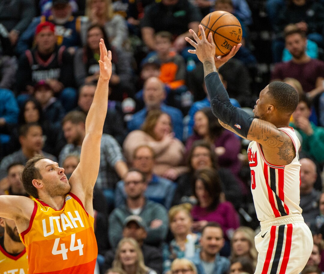 (Rick Egan  |  The Salt Lake Tribune)     Portland Trail Blazers guard Damian Lillard (0) shoots over Utah Jazz forward Bojan Bogdanovic (44), in NBA action between the Utah Jazz and the Portland Trail Blazers in Salt Lake City, Friday, Feb. 7, 2020.