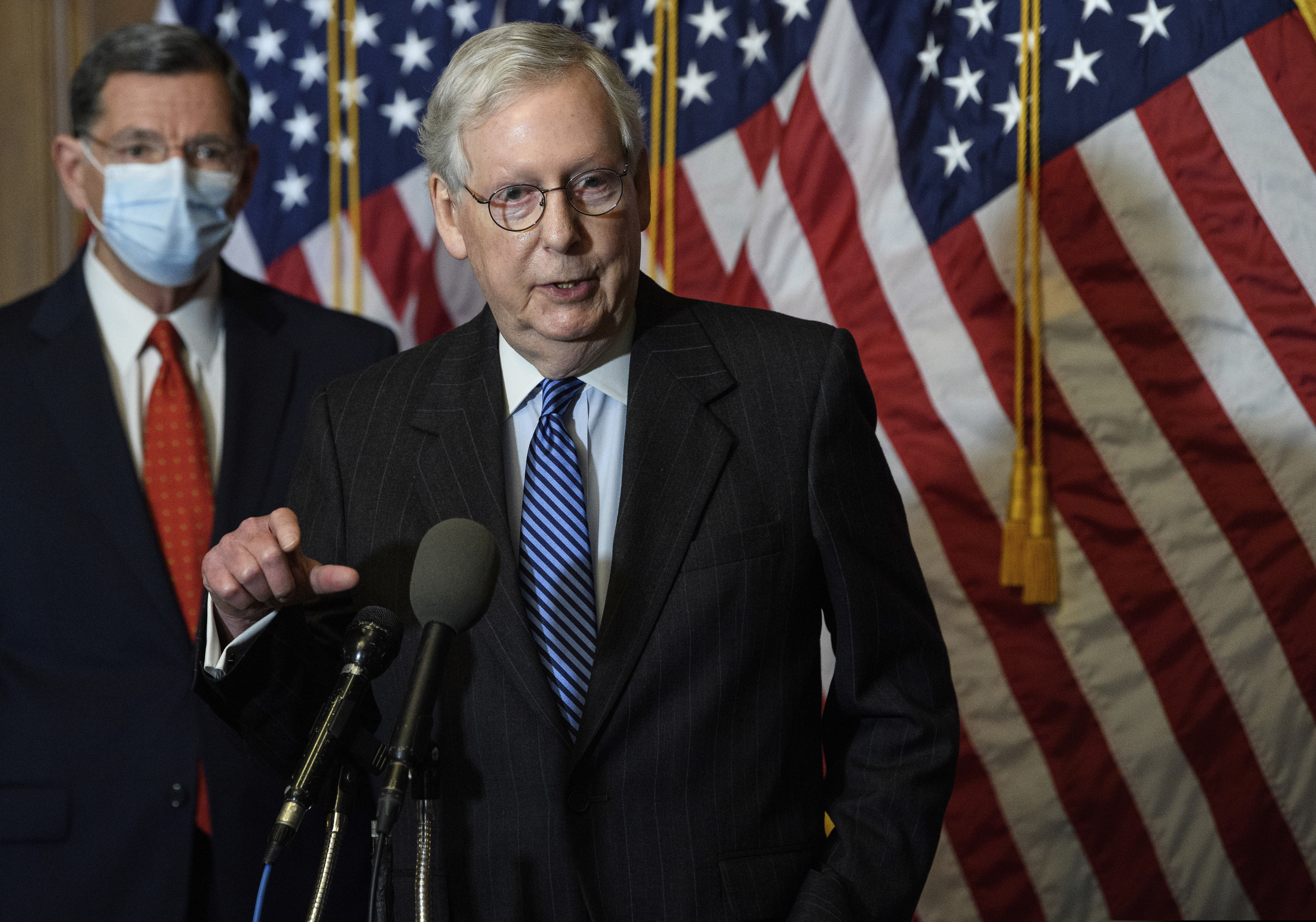(Nicholas Kamm/Pool Photo via AP, File) On Dec. 15, 2020, Senate Majority Leader Mitch McConnell, of Kentucky, speaks during a news conference with other Senate Republicans on Capitol Hill in Washington, while Sen. John Barrasso, R-Wyoming, listens at left. “There will be another major rescue package for the American people," McConnell said in announcing an agreement for a relief bill, Sunday, Dec. 20, 2020, that would total almost $900 billion. “It is packed with targeted policies to help struggling Americans who have already waited too long.”