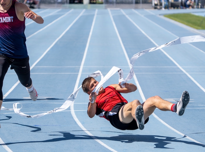 (Rick Egan | The Salt Lake Tribune)  Altamont's Ethan Hansen finishes in second place as Blake Barnes dives headfirst into the finish line for a first place finish in the 1A Boys 200 meter dash, at the State High School Championships at BYU, on Saturday, May 21, 2022.
