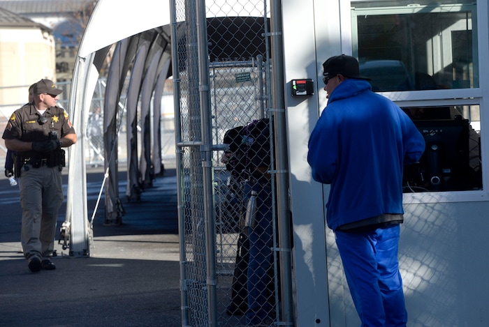 (Al Hartmann | The Salt Lake Tribune)
Starting Friday Oct. 27 homeless check in at booth at right to have their coordinated services card scanned before passing into the "safe space" courtyard outside the Road Home shelter. Security provided by the Utah Highway Patrol. The area is accessible from the south on Rio Grand Street. The area to the north at 200 South and Rio Grand is fenced and locked.