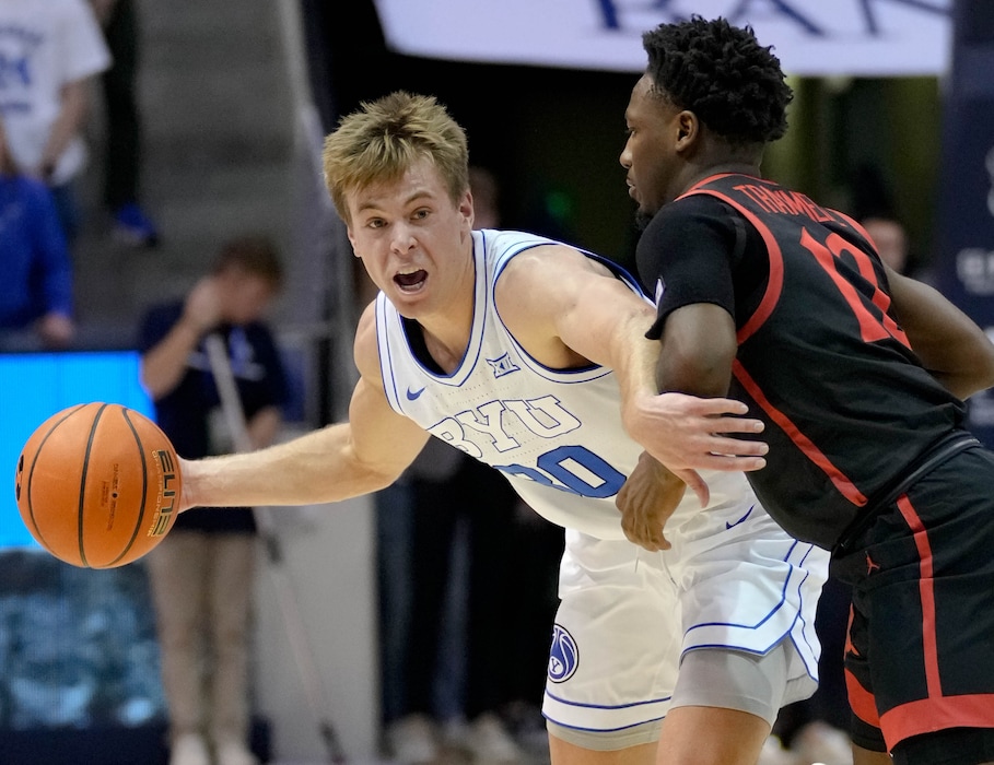 (Francisco Kjolseth  |  The Salt Lake Tribune) Brigham Young Cougars guard Dallin Hall (30) looks for a way past San Diego State Aztecs guard Darrion Trammell (12) as BYU hosts San Diego State, NCAA basketball in Provo on Friday, Nov. 10, 2023.