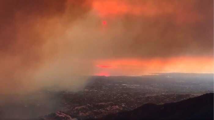 (Mike Eliason | Santa Barbara County Fire Department via AP) In this image taken from video provided by the Santa Barbara County Fire Department, smoke from a wildfire drifts towards Santa Barbara Airport in the distance in Santa Barbara, Calif., Saturday, Dec. 16, 2017. The Thomas Fire is now the third-largest in California history.