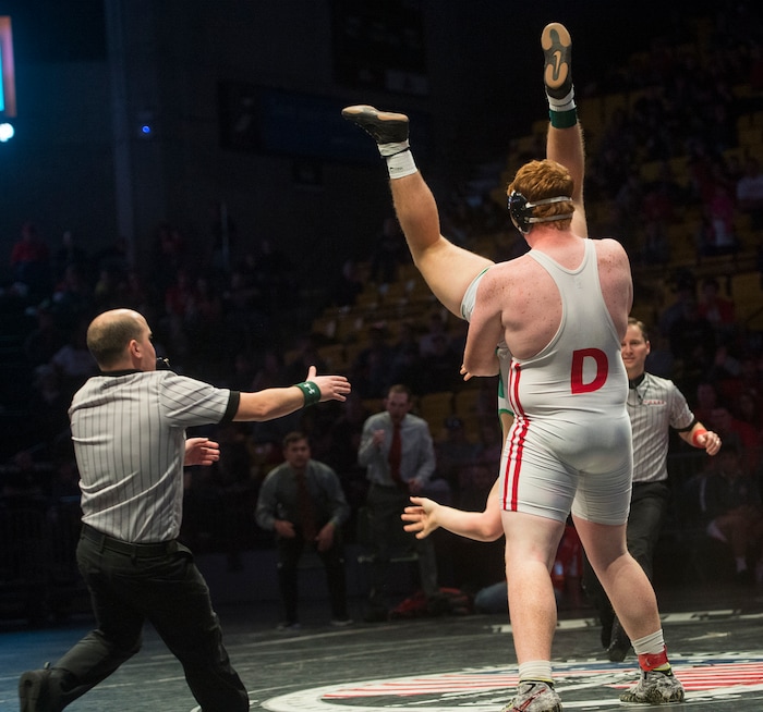 (Rick Egan  |  The Salt Lake Tribune)   Porter Fox (South Summit)is picked up by  Bradden Davis (Delta) in the 285 weight class, Fox won the match (Dec 5-3) in 3A State Wrestling at UVU in Orem, Saturday, February 10, 2018.