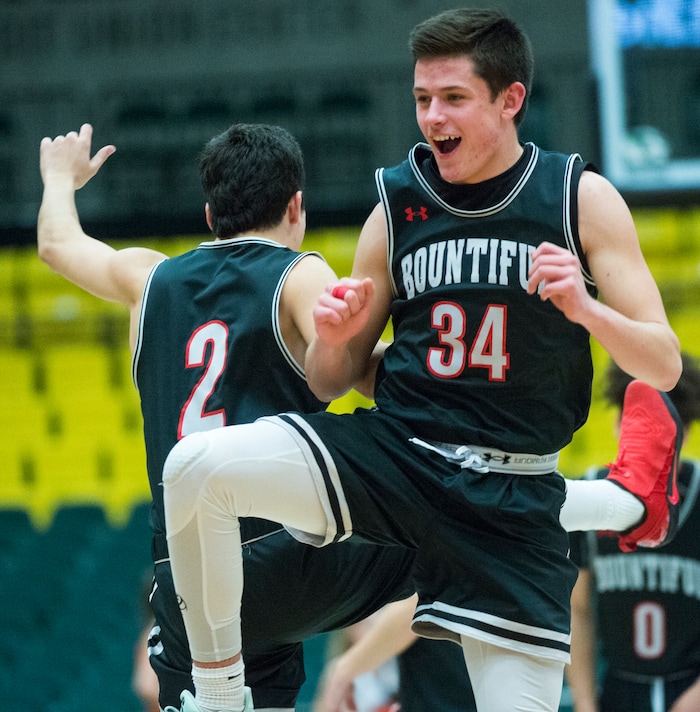 (Rick Egan  |  The Salt Lake Tribune)   Bountiful Braves Camden Jones (2) and  Cooper Ohlson (34) celebrate the Braves win over the Falcons, in 5A basketball playoff action between the Bountiful Braves and Skyridge Falcons, at the UCCU Center in Orem, Monday, Feb. 26, 2018.