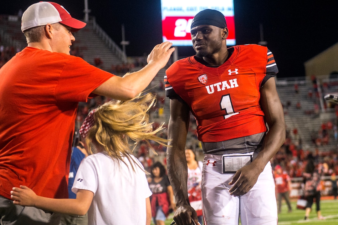 (Chris Detrick  |  The Salt Lake Tribune)  Utah fans congratulate Utah Utes quarterback Tyler Huntley (1) after the game at Rice-Eccles Stadium Thursday, August 31, 2017. Utah Utes defeated North Dakota Fighting Hawks 37-16.