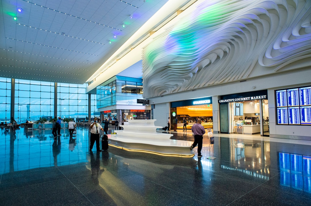 (Rick Egan  |  The Salt Lake Tribune)   Passengers and employees walk down the new terminal at the Salt Lake City International Airport on Tuesday, Sept. 15, 2020.