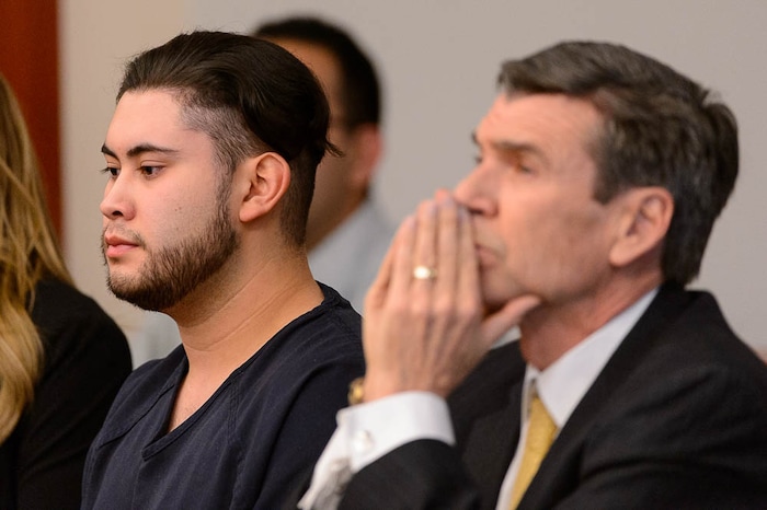 (Trent Nelson | The Salt Lake Tribune)  Abraham Miranda listens to statements from victims and their families at his sentencing in Salt Lake City, Thursday December 21, 2017. Miranda, 19, pleaded guilty to manslaughter counts for a February crash that killed two of his West High School classmates and critically injured a pregnant woman and her baby. At right is Miranda's attorney Greg Skordas.