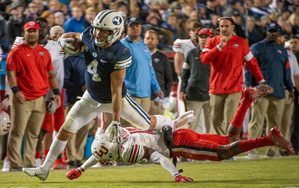 (Rick Egan  |  The Salt Lake Tribune)    Brigham Young running back Lopini Katoa (4) runs the ball for the Cougars, in football action between the Brigham Young Cougars and the Liberty Flames at Lavell Edwards Stadium in Provo, Saturday, Nov. 9, 2019.